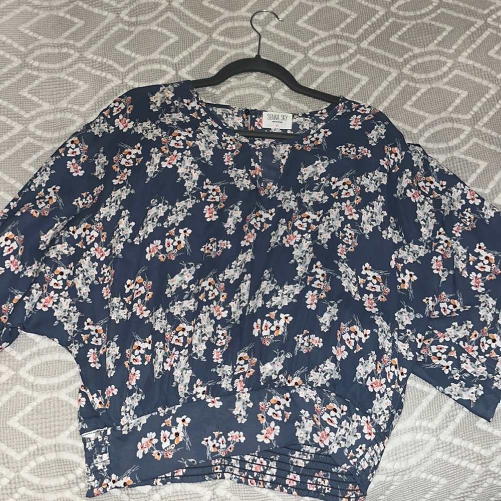 Blue Sienna Sky crop blouse with floral patterns